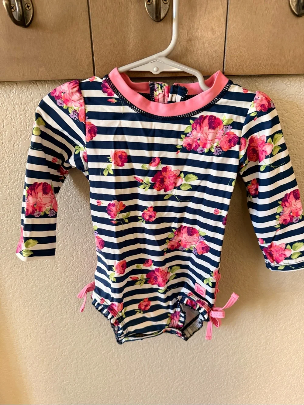 Ruffle Butts Navy & White Stripe Rash Guard with Pink Trim and Floral Accents